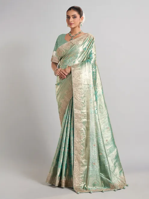 Pista green kanjivaram silk saree with elegant zari work