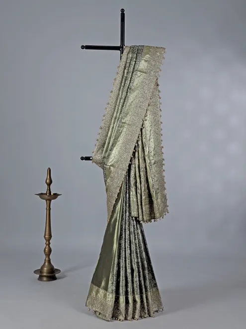Pista green kanjivaram silk saree with ornate embellishments