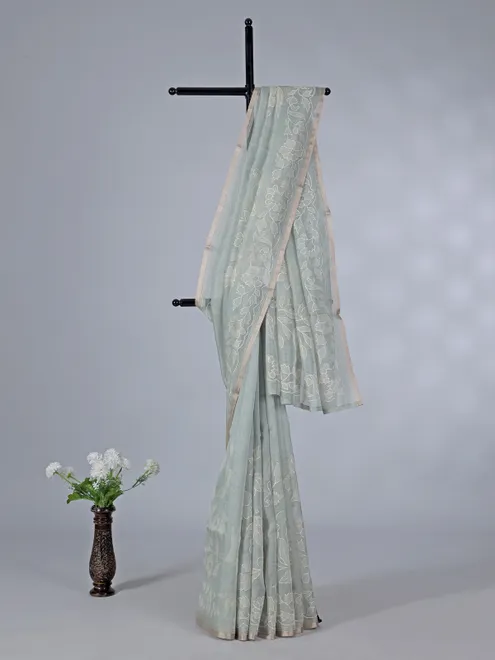 Pista green semi organza saree with refined embroidery touch