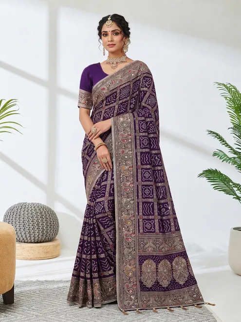Purple georgette saree with bird motif border design