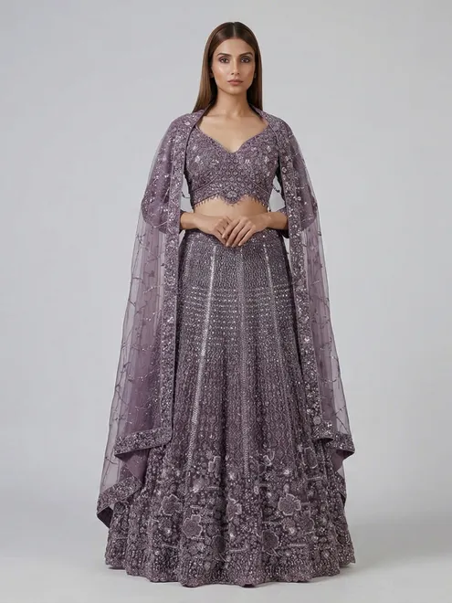 Purple net sequins and pearl embellished party wear lehenga choli