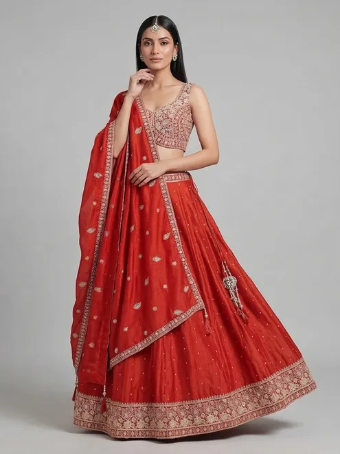 Radiant rust orange silk lehenga choli with embroidered sparkle