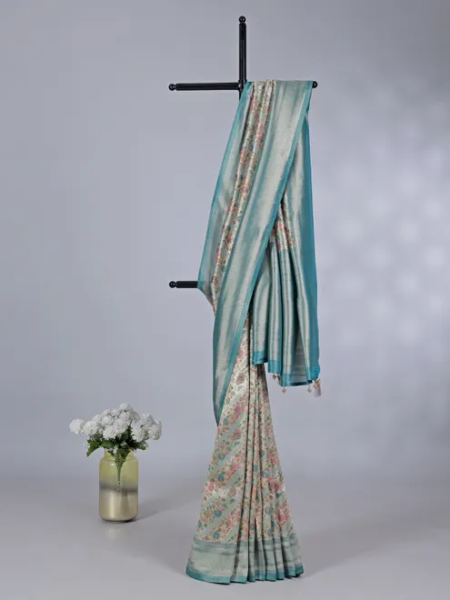 Rama blue georgette silk saree with floral accents
