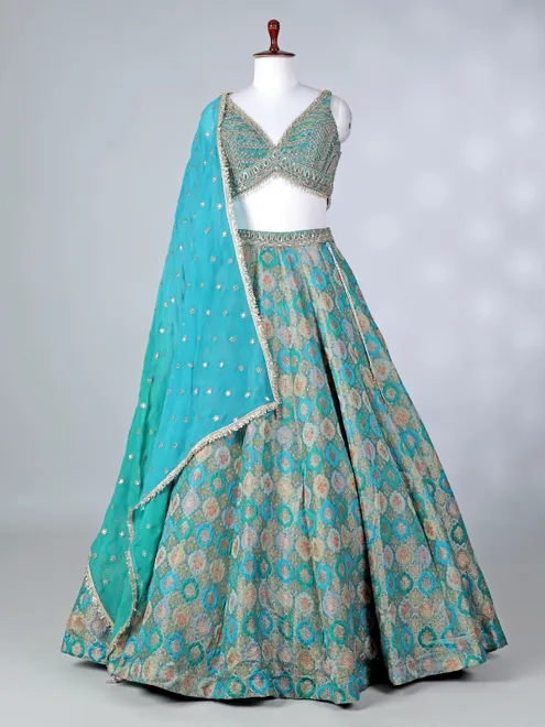 Rama green lehenga choli with colorful motifs
