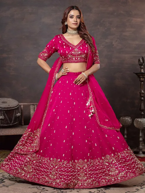 Rani color lehenga choli with elegant craftsmanship