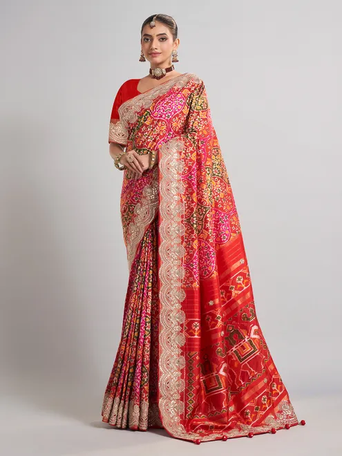 Red hyderabadi patola silk saree with a royal bridal look