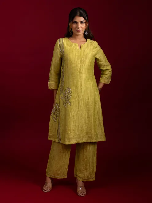 Refreshing lime green printed suit with delicate thread work