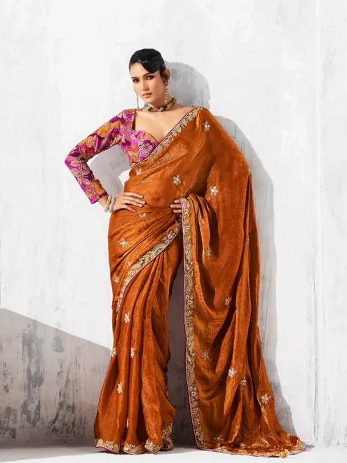 Rust orange tissue silk saree accented with resham work