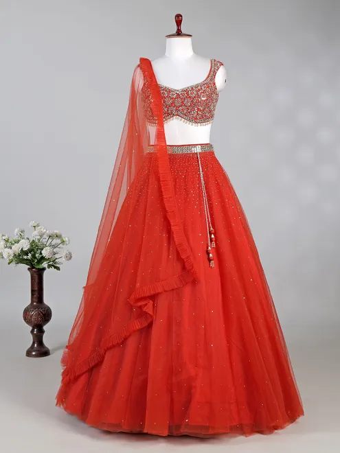 Rust red net lehenga choli with sparkling sequins