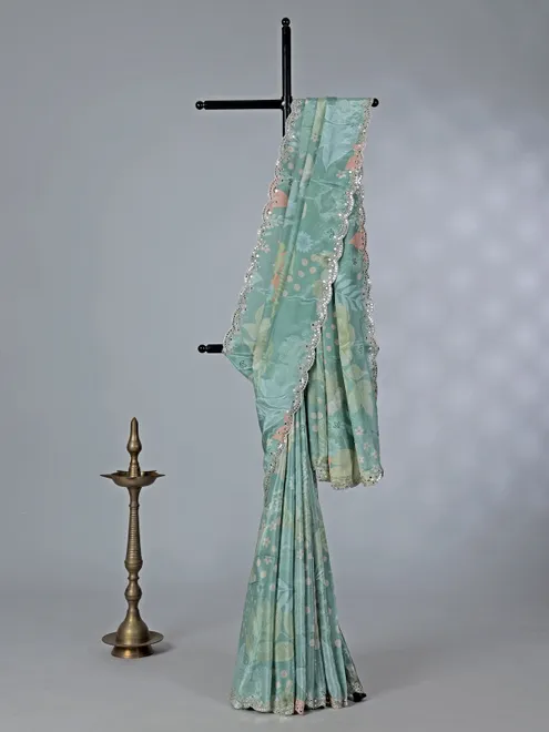 Sage green crepe silk saree with sequins and mirror work