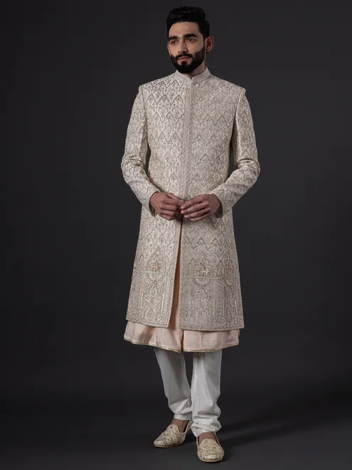 Stunning peach silk wedding sherwani for groom