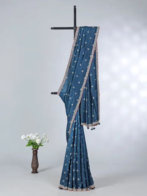 Teal blue festive wear dola silk saree with contrast pink blouse