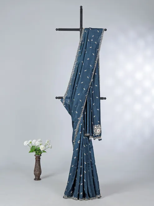 Teal blue festive wear dola silk saree with cutdana embellishment