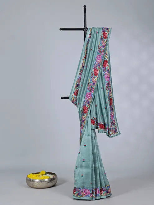 Teal blue tissue saree with floral grace