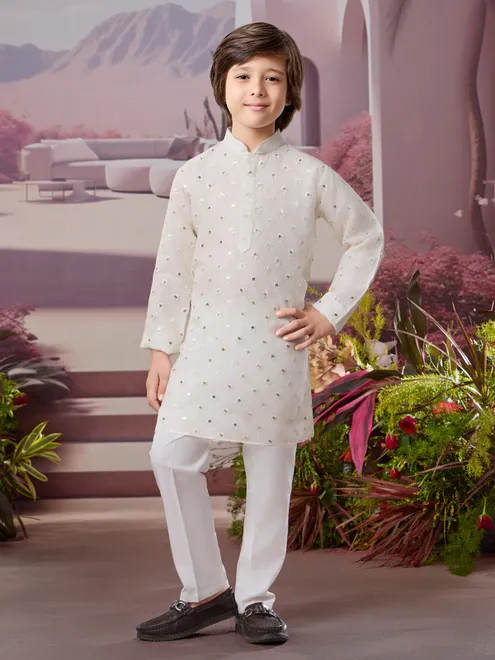 White silk kurta set with subtle glow