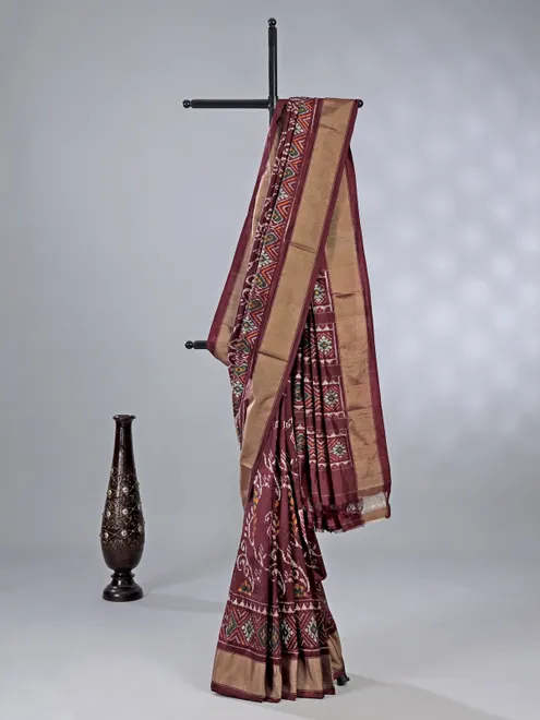 Wine zari weaving patola silk saree with regal prints