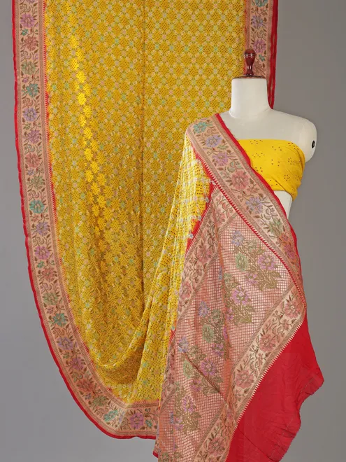 Yellow bandhej silk saree with unstitched blouse
