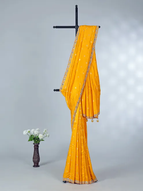 Yellow festive wear dola silk saree with cutdana detailing