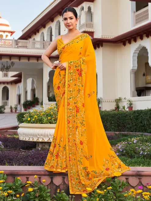 Yellow georgette saree with printed stone detail
