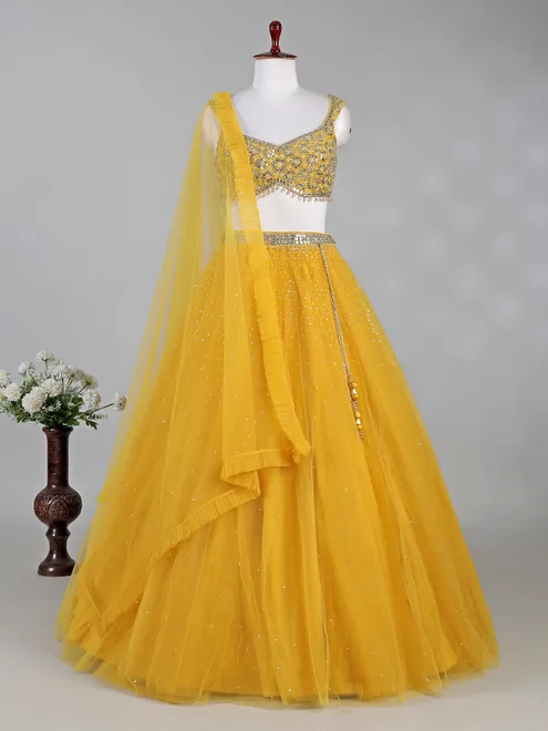 Yellow net lehenga choli with aabla and diamond work