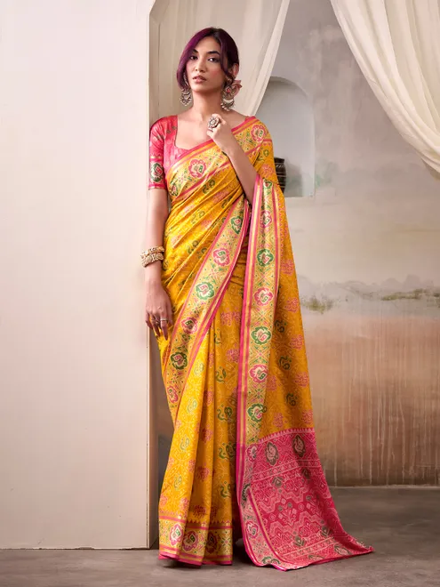 Yellow patola silk saree with pink blouse