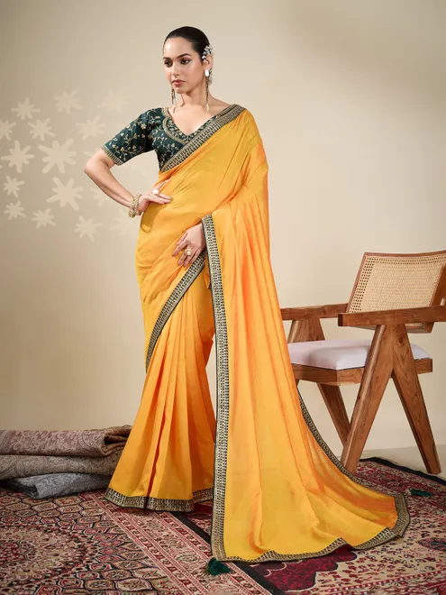 Yellow plain silk saree with green blouse