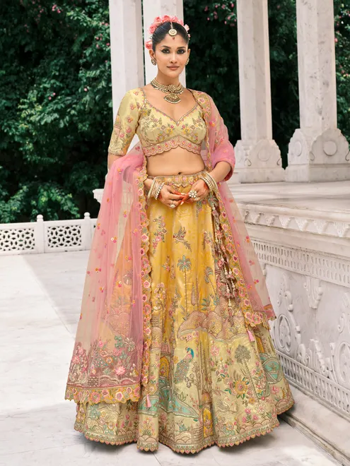 Yellow silk lehenga choli with resham and sequins glow