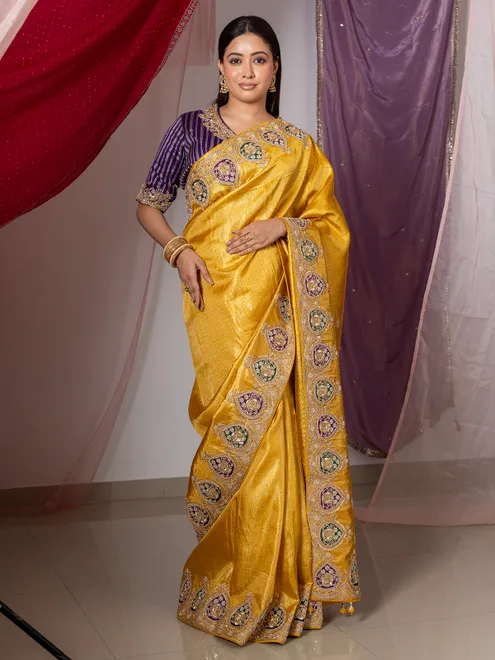 Yellow silk wedding wear saree with sequins work