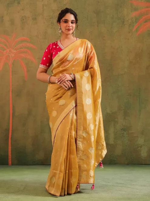 Yellow silk zari embellished saree with magenta blouse