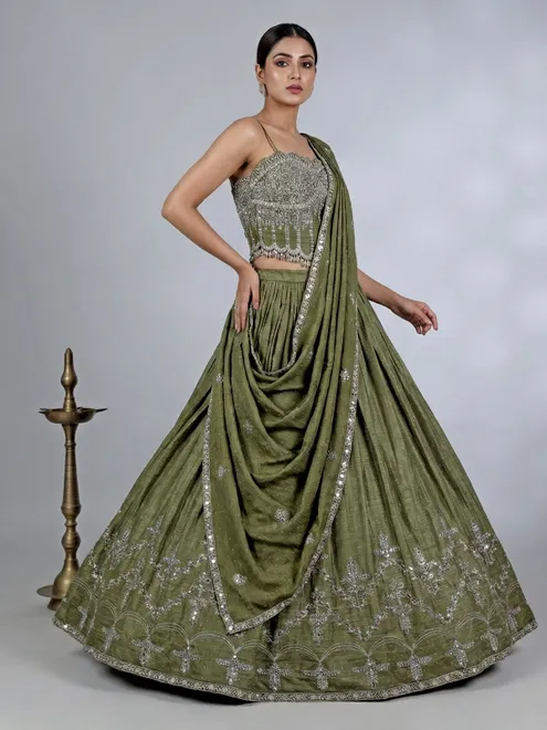 Mehendi green silk lehenga choli with cutdana glow