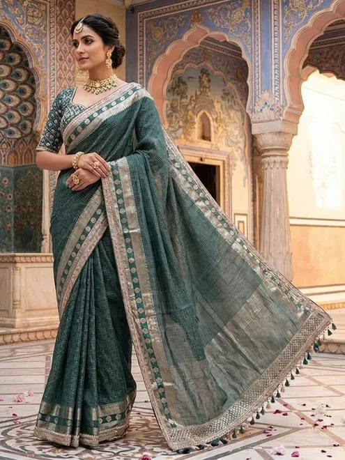 Bottle green dola silk saree with zari weaving