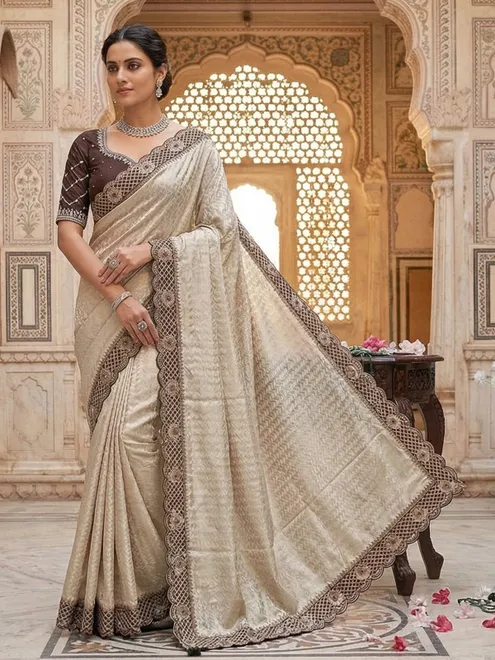 Cream silk saree with stone and zardosi work