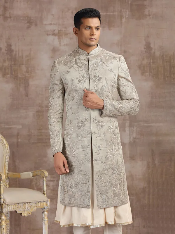 Antique gold tissue silk peshwai sherwani with royal detailing