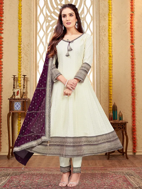 Beautiful off-white and purple suit for festive