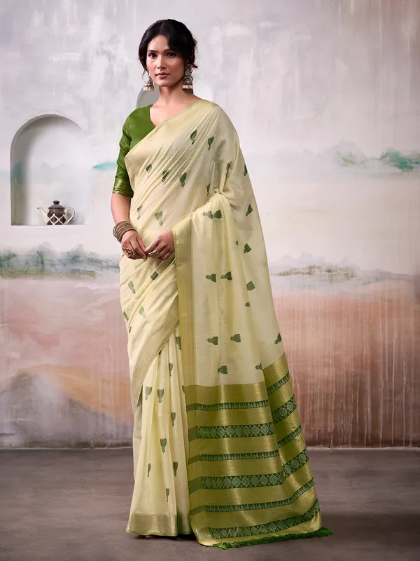 Beige cotton saree with green motifs