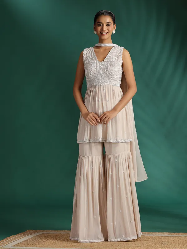 Beige embellished sharara suit with dupatta