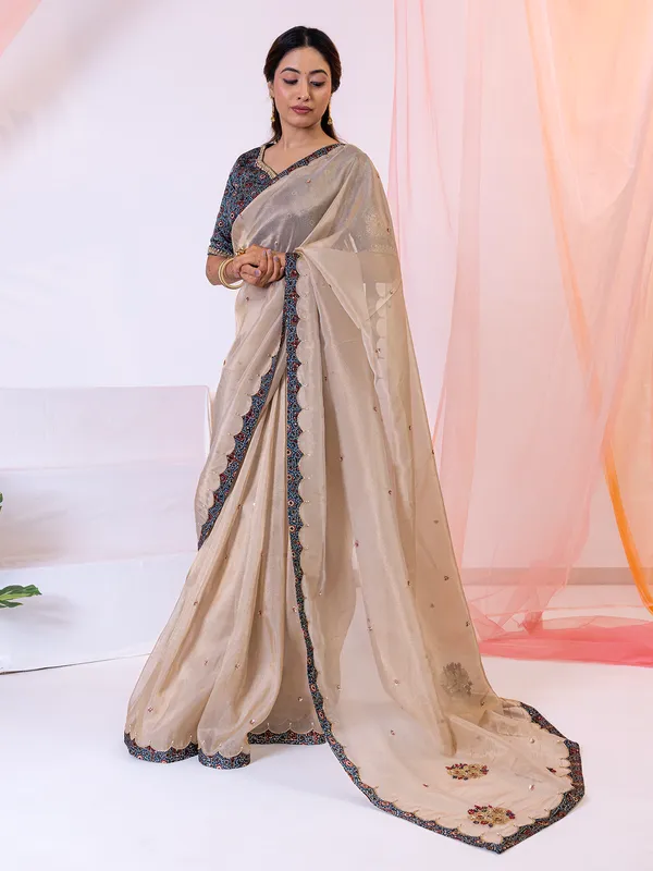 Beige festive wear tissue silk saree