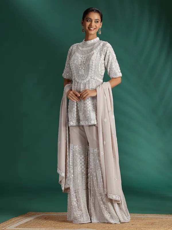 Beige georgette sharara suit with heavy work