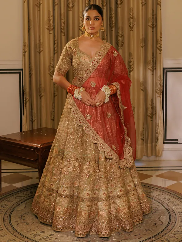 Beige silk bridal lehenga choli with red dupatta