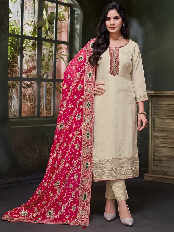 Beige silk salwar suit with printed red dupatta
