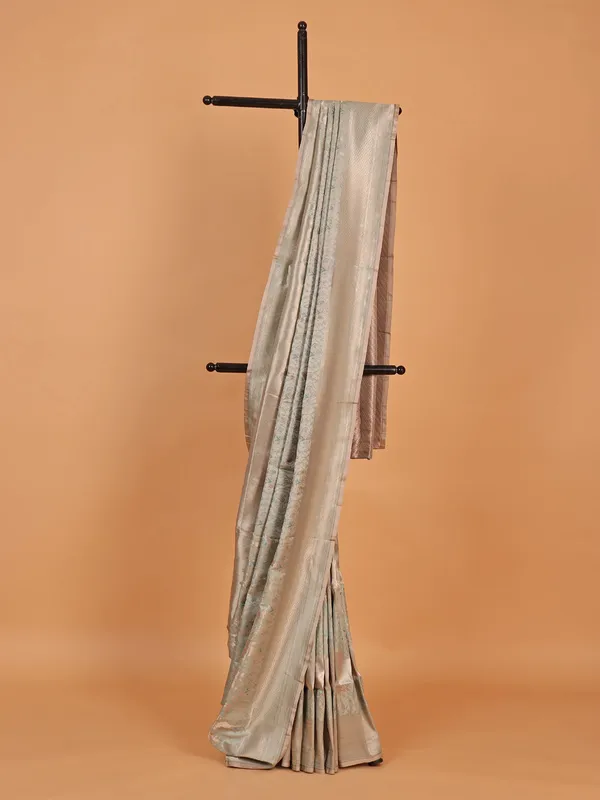 Beige silk saree with golden zari work