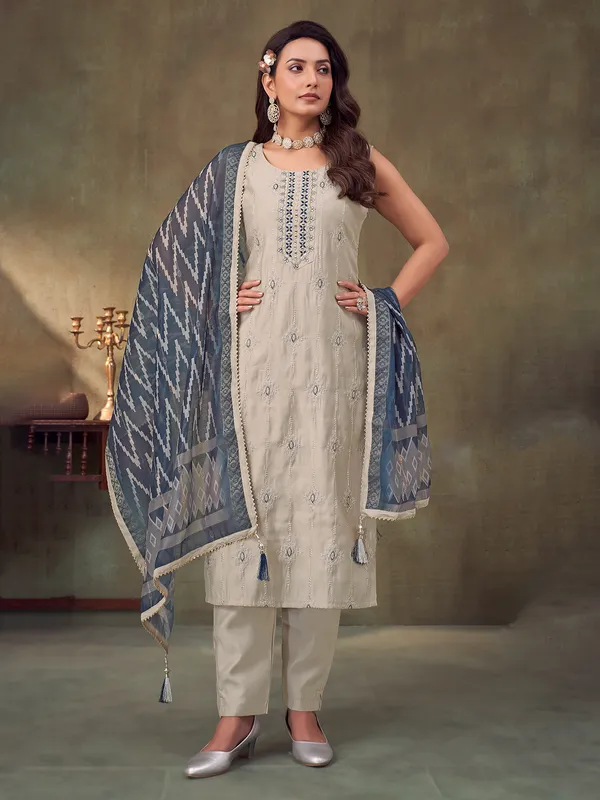 Beige silk sleeveless salwar suit with dupatta