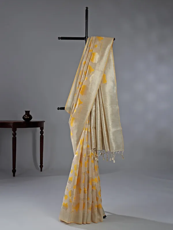 Beige yellow printed zari semi cotton saree