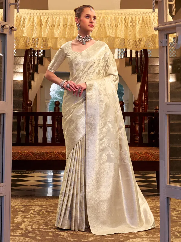 Beige zari worked saree in satin silk