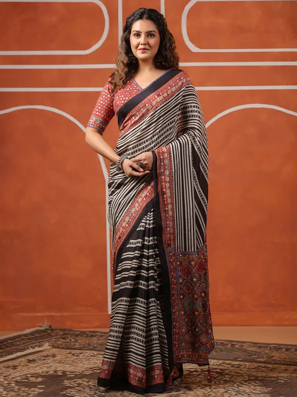Black muslin printed saree with ready made blouse