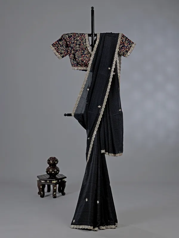 Black muslin silk printed saree with festive detailing