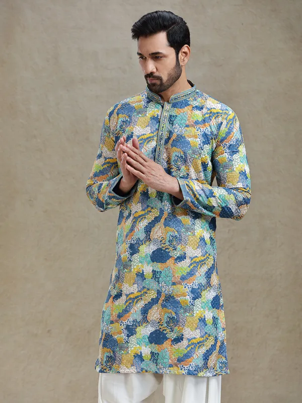 Blue printed kurta salwar set in textured embroidery