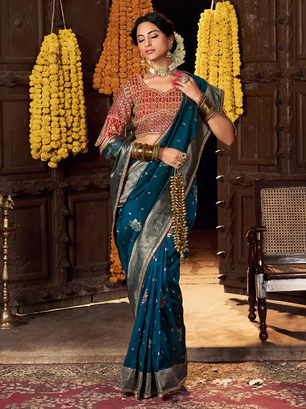 Blue silk saree with rich embellished blouse
