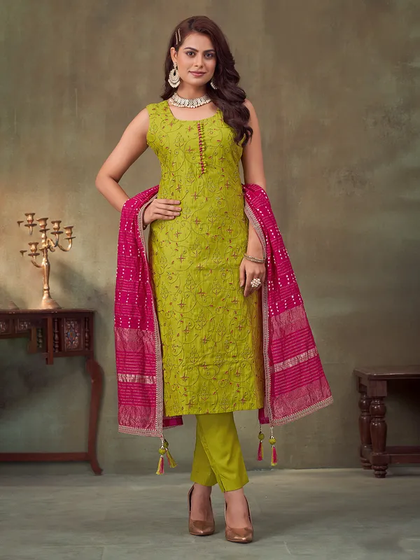 Bright green sleeveless silk suit for festive wear