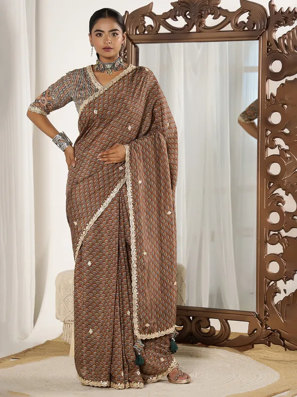 Brown muslin saree with ready made blouse